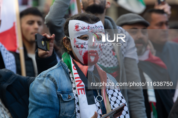 A thousand protesters take part in a protest demanding a ceasefire and opposing ongoing Israeli attacks on Gaza and Lebanon in Duesseldorf,...