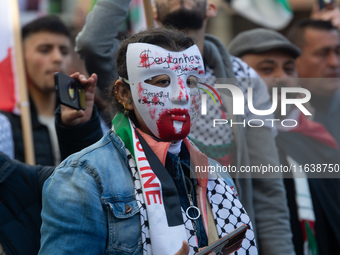 A thousand protesters take part in a protest demanding a ceasefire and opposing ongoing Israeli attacks on Gaza and Lebanon in Duesseldorf,...