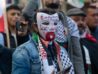 A thousand protesters take part in a protest demanding a ceasefire and opposing ongoing Israeli attacks on Gaza and Lebanon in Duesseldorf,...