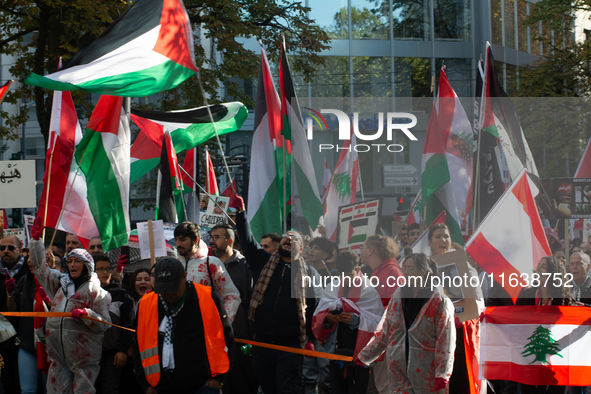 A thousand protesters take part in a protest demanding a ceasefire and opposing ongoing Israeli attacks on Gaza and Lebanon in Duesseldorf,...