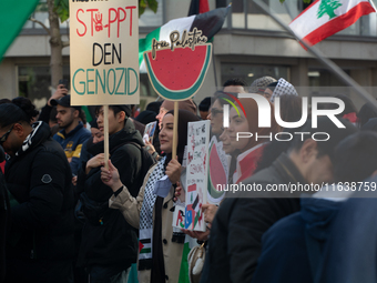 A thousand protesters take part in a protest demanding a ceasefire and opposing ongoing Israeli attacks on Gaza and Lebanon in Duesseldorf,...