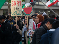 A thousand protesters take part in a protest demanding a ceasefire and opposing ongoing Israeli attacks on Gaza and Lebanon in Duesseldorf,...