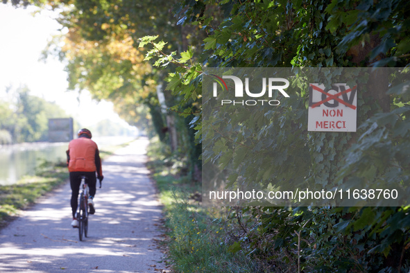 A cyclist rides on the Canal du Midi near Toulouse. Zadists, or development protesters, begin to install a ZAD (Zone to Defend, a militant o...