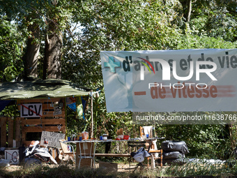 Along the Canal du Midi, near Toulouse, France, on October 4, 2024, zadists display a banner reading 'more trees and more life, less speed'....