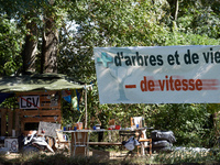 Along the Canal du Midi, near Toulouse, France, on October 4, 2024, zadists display a banner reading 'more trees and more life, less speed'....