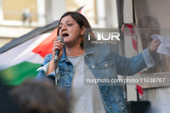 Oezlem Alev Demirel of the Linke party speaks in support of protesters as thousands of protesters take part in a protest demanding a ceasefi...