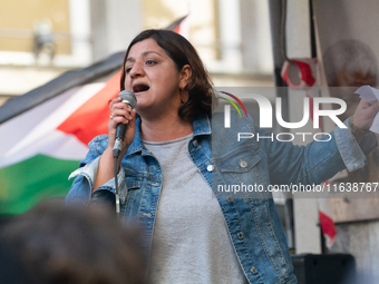 Oezlem Alev Demirel of the Linke party speaks in support of protesters as thousands of protesters take part in a protest demanding a ceasefi...