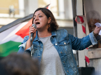 Oezlem Alev Demirel of the Linke party speaks in support of protesters as thousands of protesters take part in a protest demanding a ceasefi...