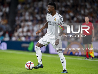 Vinicius Junior of Real Madrid CF is in action with the ball during the La Liga EA Sports 2024/25 football match between Real Madrid CF and...