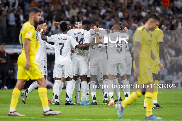 Players of Real Madrid CF (from L to R) Vinicius Junior, Aurelien Tchouameni, Antonio Rudiger, and Kylian Mbappe celebrate a goal during the...