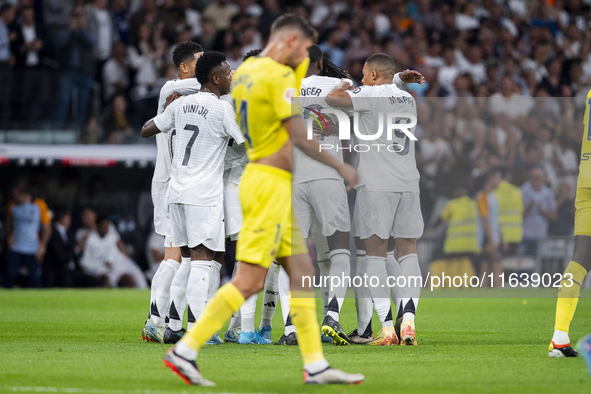 Players of Real Madrid CF (from L to R) Vinicius Junior, Aurelien Tchouameni, Antonio Rudiger, and Kylian Mbappe celebrate a goal during the...