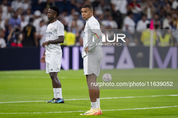 Kylian Mbappe of Real Madrid CF (L) is seen during the La Liga EA Sports 2024/25 football match between Real Madrid CF and Villarreal CF at...