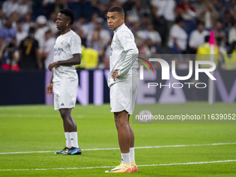 Kylian Mbappe of Real Madrid CF (L) is seen during the La Liga EA Sports 2024/25 football match between Real Madrid CF and Villarreal CF at...