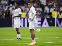 Kylian Mbappe of Real Madrid CF (L) is seen during the La Liga EA Sports 2024/25 football match between Real Madrid CF and Villarreal CF at...