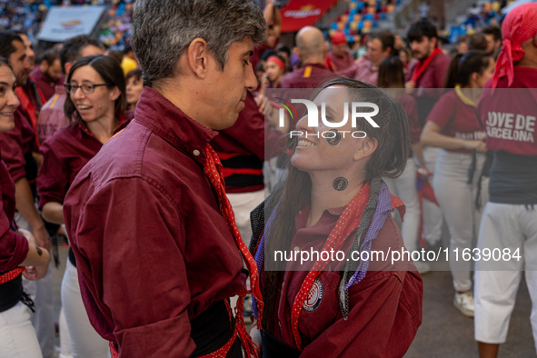 A couple from Colla Castellera Jove de Barcelona participates in the Concurs de Castells competition in Tarragona, Spain, on October 5, 2024...