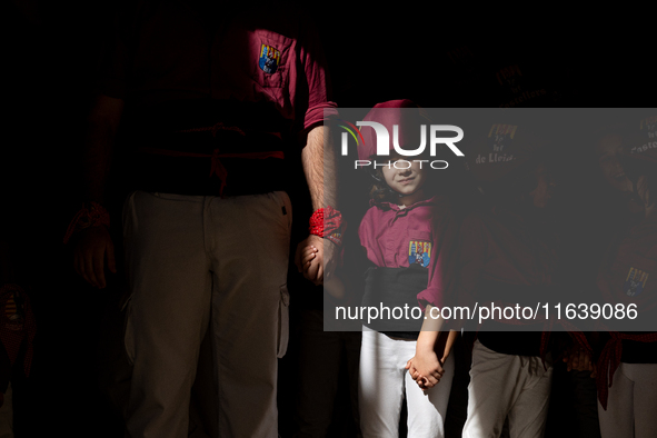 A child waits to participate in the Concurs de Castells competition in Tarragona, Spain, on October 5, 2024. 