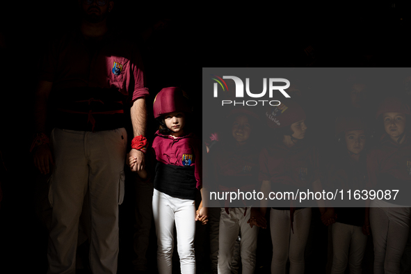 A child waits to participate in the Concurs de Castells competition in Tarragona, Spain, on October 5, 2024. 