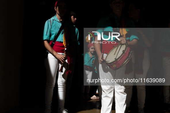 A child waits to participate in the Concurs de Castells competition in Tarragona, Spain, on October 5, 2024. 