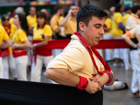 A man prepares for a human tower during the Concurs de Castells competition in Tarragona, Spain, on October 5, 2024. (