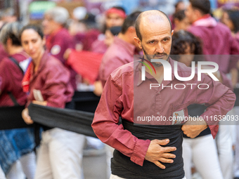 A man prepares for a human tower during the Concurs de Castells competition in Tarragona, Spain, on October 5, 2024. (