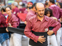 A man prepares for a human tower during the Concurs de Castells competition in Tarragona, Spain, on October 5, 2024. (