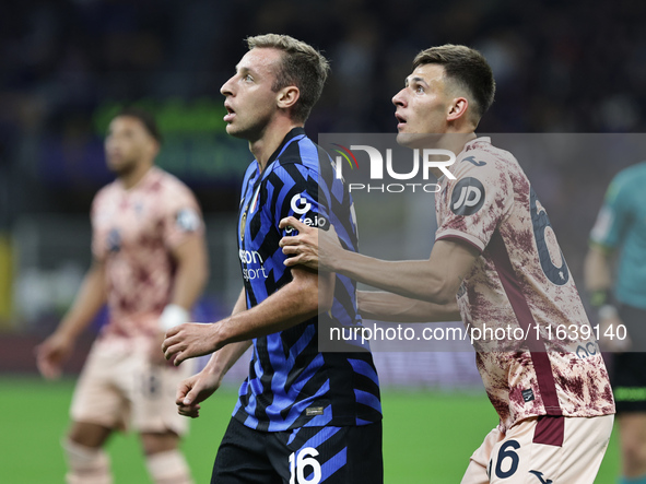 Davide Frattesi and Gvidas Gineitis participate in the Serie A 2024-2025 match between Inter and Torino in Milano, Italy, on October 5, 2024...