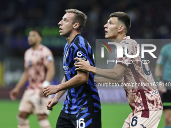 Davide Frattesi and Gvidas Gineitis participate in the Serie A 2024-2025 match between Inter and Torino in Milano, Italy, on October 5, 2024...