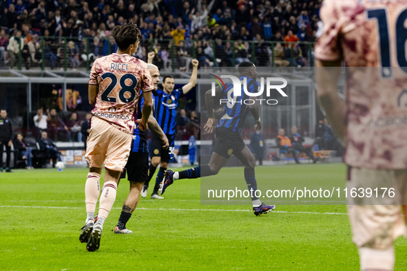 Marcus Thuram celebrates after scoring a goal during the Serie A football match between FC Internazionale and Torino FC at Stadio Giuseppe M...