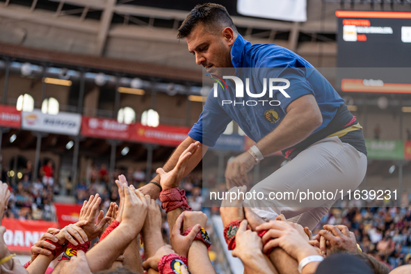 A member of Castellers de Berga participates in the Concurs de Castells competition in Tarragona, Spain, on October 5, 2024. 