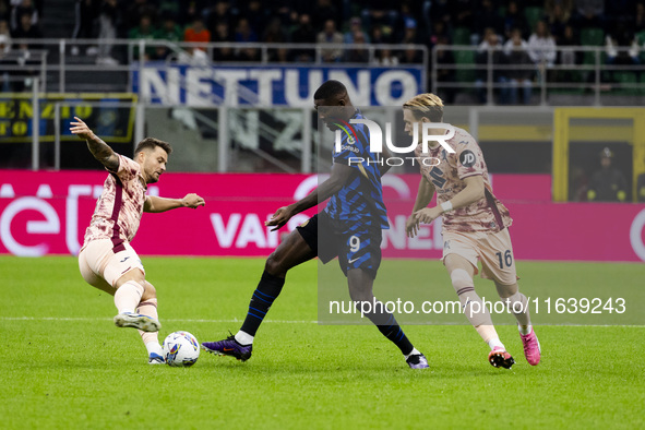 Marcus Thuram and Marcus Pedersen are in action during the Serie A match between FC Internazionale and Torino FC at Stadio Giuseppe Meazza i...