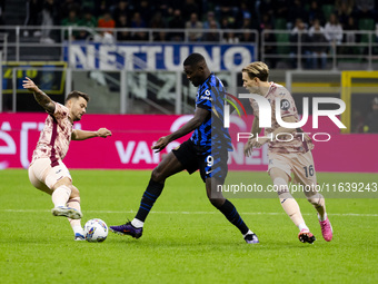 Marcus Thuram and Marcus Pedersen are in action during the Serie A match between FC Internazionale and Torino FC at Stadio Giuseppe Meazza i...