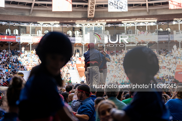 Members of Castellers de la Vila de Gracia participate in the Concurs de Castells competition in Tarragona, Spain, on October 5, 2024. 