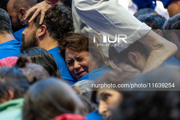 Members of Castellers de la Vila de Gracia participate in the Concurs de Castells competition in Tarragona, Spain, on October 5, 2024. 