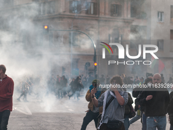 Clashes with the police and pro-Palestine demonstrations occur during the pro-Palestinian demonstration calling for an end to Israeli attack...