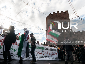 People from some Palestinian associations in Italy participate in a national pro-Palestine demonstration in Rome, Italy, on October 5, 2024,...