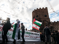 People from some Palestinian associations in Italy participate in a national pro-Palestine demonstration in Rome, Italy, on October 5, 2024,...