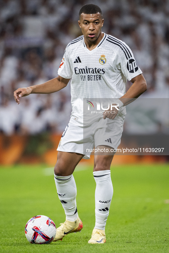 Kylian Mbappe of Real Madrid CF is in action with the ball during the La Liga EA Sports 2024/25 football match between Real Madrid CF and Vi...