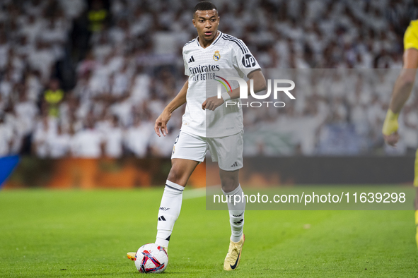 Kylian Mbappe of Real Madrid CF is in action with the ball during the La Liga EA Sports 2024/25 football match between Real Madrid CF and Vi...