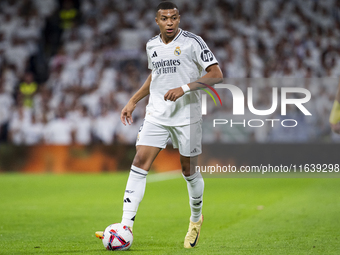 Kylian Mbappe of Real Madrid CF is in action with the ball during the La Liga EA Sports 2024/25 football match between Real Madrid CF and Vi...