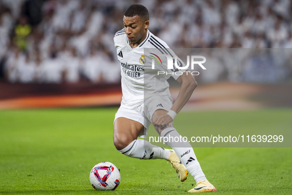 Kylian Mbappe of Real Madrid CF is in action with the ball during the La Liga EA Sports 2024/25 football match between Real Madrid CF and Vi...