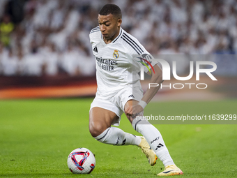 Kylian Mbappe of Real Madrid CF is in action with the ball during the La Liga EA Sports 2024/25 football match between Real Madrid CF and Vi...