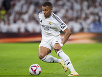 Kylian Mbappe of Real Madrid CF is in action with the ball during the La Liga EA Sports 2024/25 football match between Real Madrid CF and Vi...