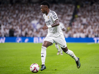 Vinicius Junior of Real Madrid CF is in action with the ball during the La Liga EA Sports 2024/25 football match between Real Madrid CF and...