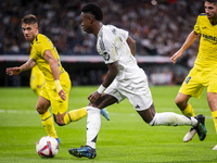 Vinicius Junior of Real Madrid CF is in action with the ball during the La Liga EA Sports 2024/25 football match between Real Madrid CF and...