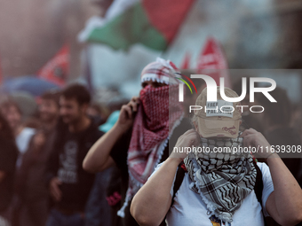 People from some Palestinian associations in Italy participate in a national pro-Palestine demonstration in Rome, Italy, on October 5, 2024,...