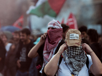 People from some Palestinian associations in Italy participate in a national pro-Palestine demonstration in Rome, Italy, on October 5, 2024,...