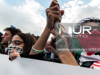 People from some Palestinian associations in Italy participate in a national pro-Palestine demonstration in Rome, Italy, on October 5, 2024,...