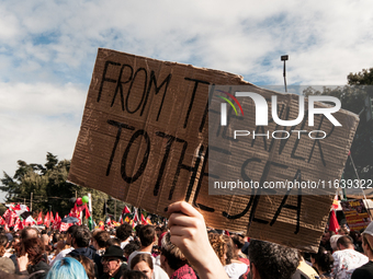 People from some Palestinian associations in Italy participate in a national pro-Palestine demonstration in Rome, Italy, on October 5, 2024,...