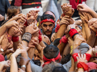 Members of Tirallongues de Manresa participate in the Concurs de Castells competition in Tarragona, Spain, on October 5, 2024. (