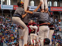 Members of Tirallongues de Manresa participate in the Concurs de Castells competition in Tarragona, Spain, on October 5, 2024. (